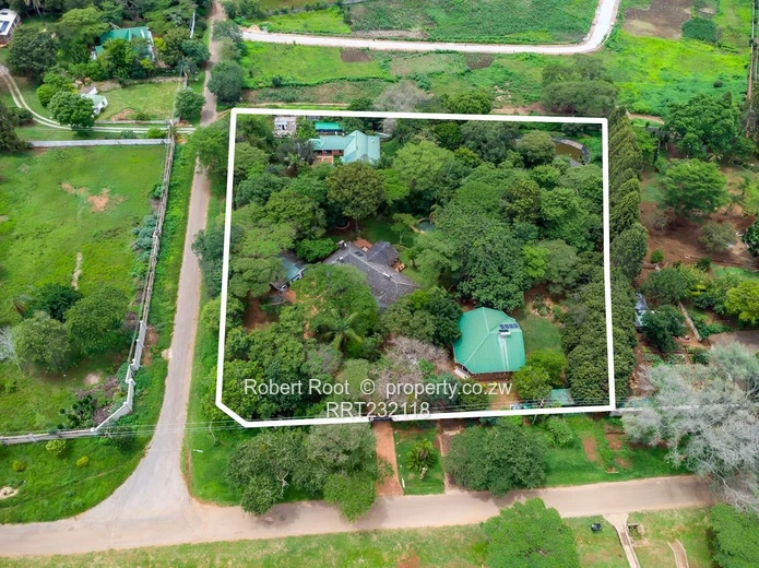 Fantastic Investment Opportunity  Two Homes on Two Acres!   Beautiful trees and prolific bird life. 