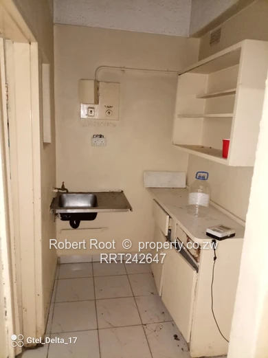 1-Bed Harare CBD Flat — Tiled Floors, Fitted Kitchen